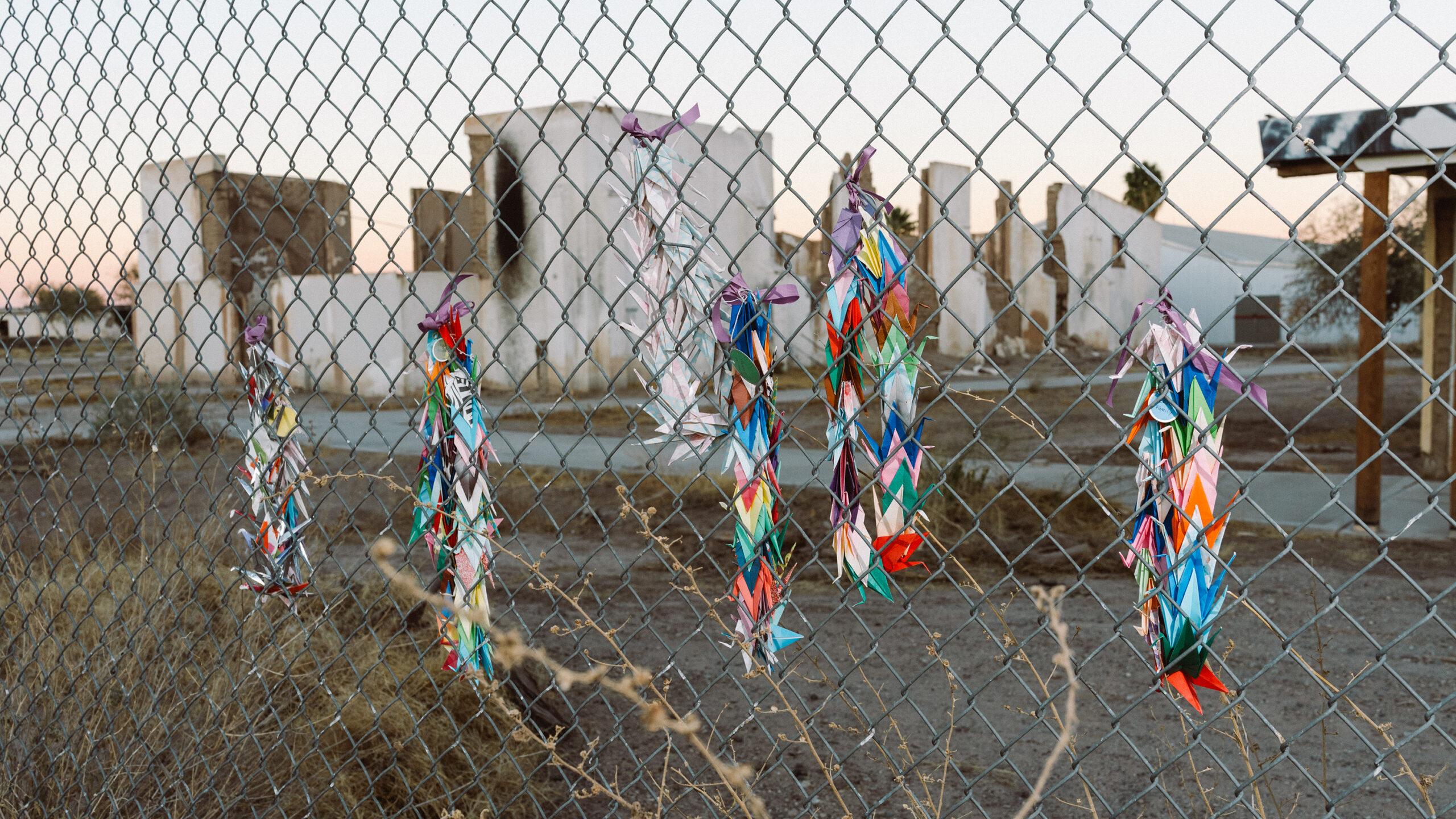 Cranes line the fencing perimeter of Poston Camp 1, one of the incarceration sites located in Parker, Ariz., on the Colorado River Indian Tribes Reservation.